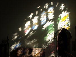 image of light projected on window onto wall